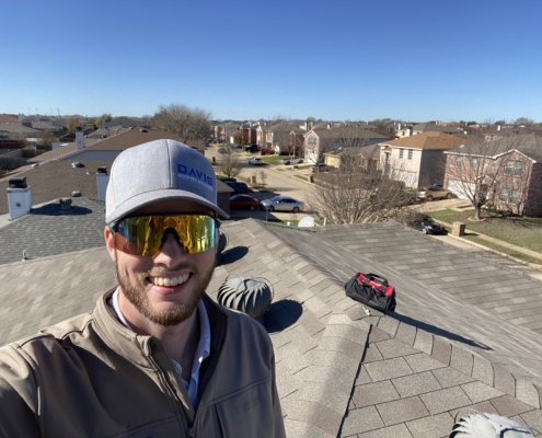 Carson on a roof after a minor repair