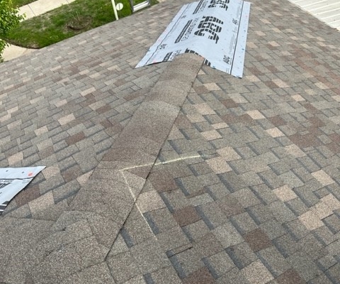 This is an example of an emergency tarp over a ridge to prevent leaks