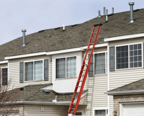 Ladder extending to roof for repairs