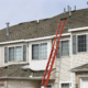 Ladder extending to roof for repairs