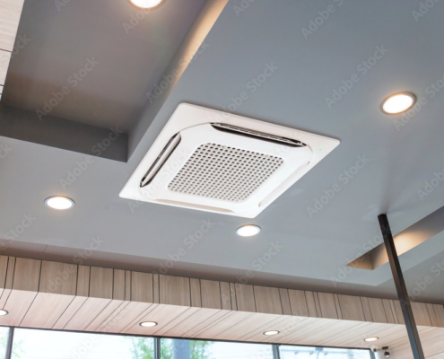 Modern ceiling mounted cassette type air conditioning system in coffee shop