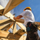 roofer ,carpenter working on roof structure at construction site