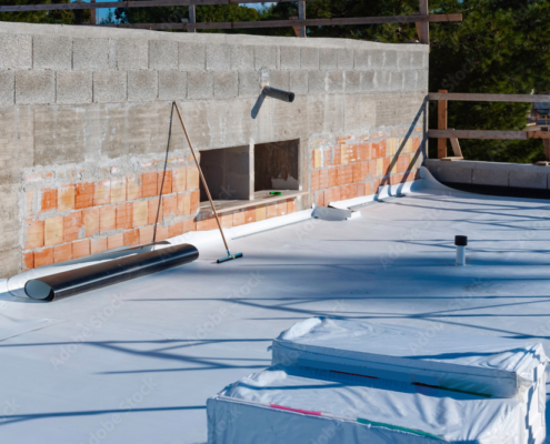 Worker on application Synthetic waterproofing PVC-P and TPO / FPO