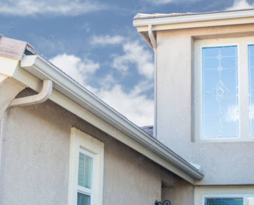 House with New Seamless Aluminum Rain Gutters.