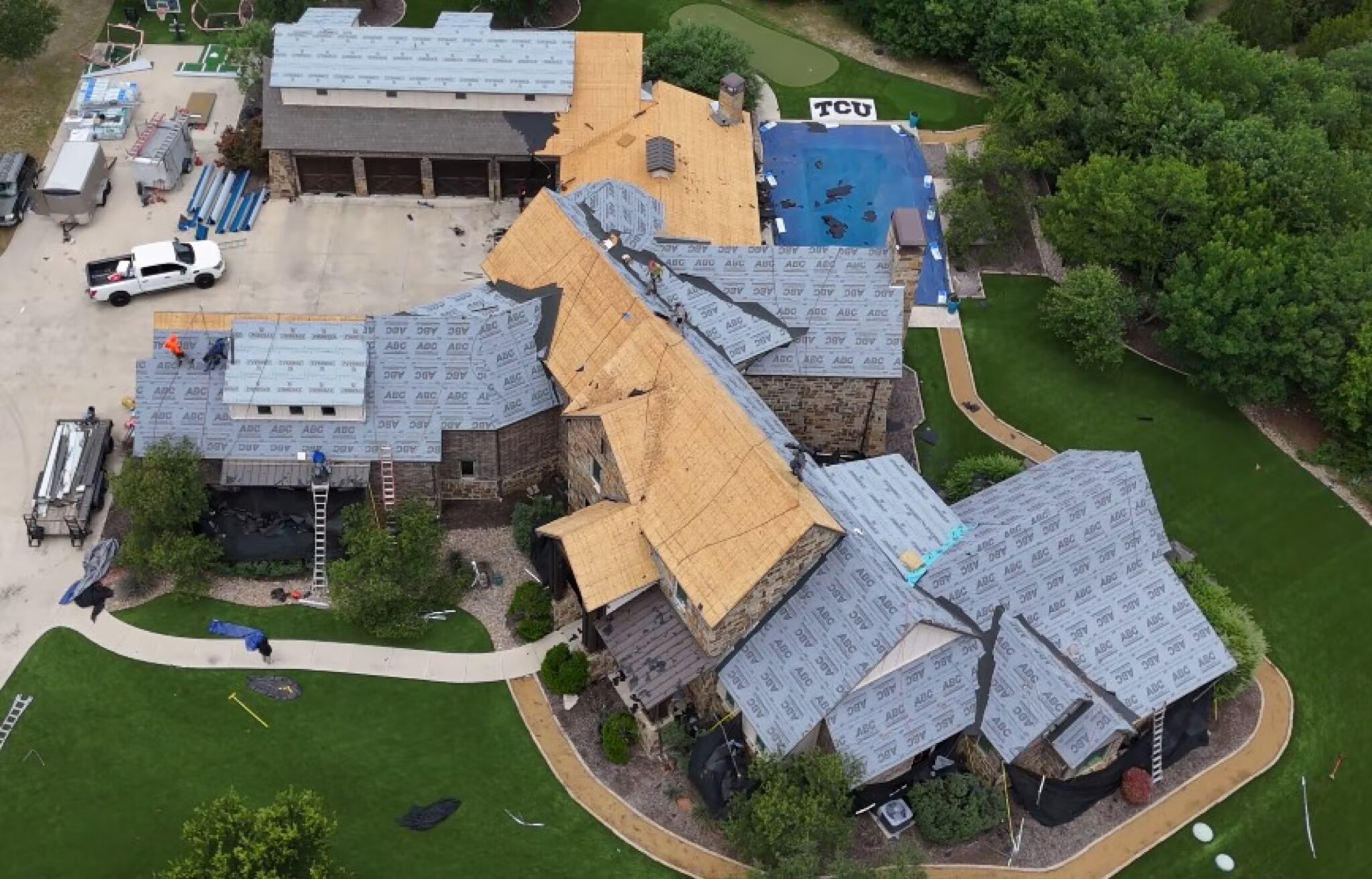 Davis Roofing Solutions replacing the roof on a large Dallas-Fort Worth estate